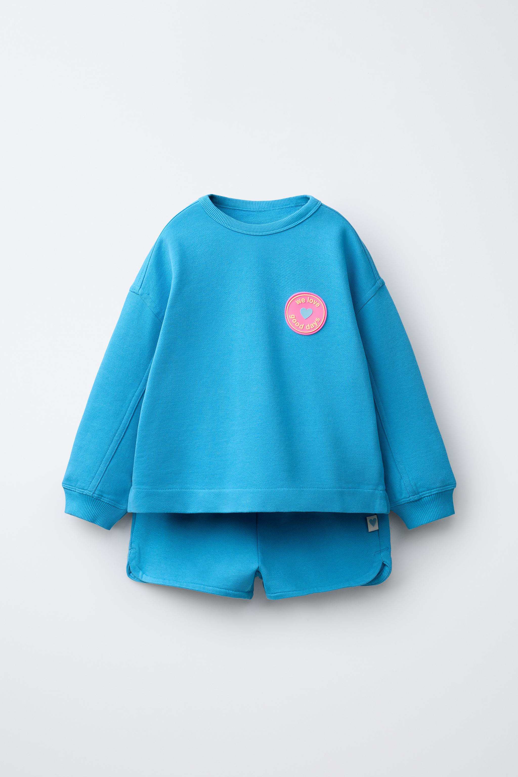 ENSEMBLE SWEAT ET BERMUDA À FLEUR GOMMÉE